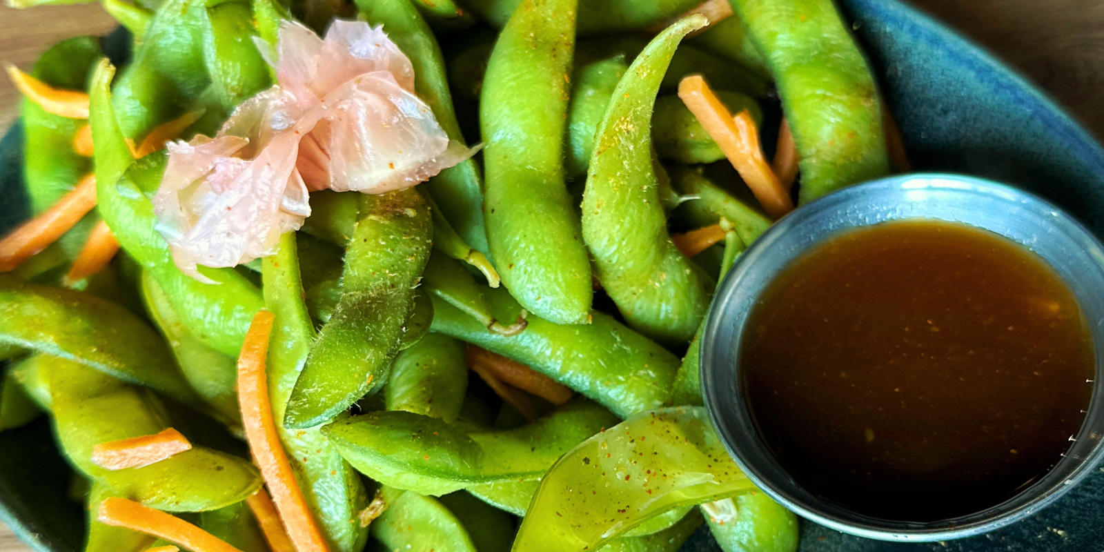 Edamame pods with dipping sauce